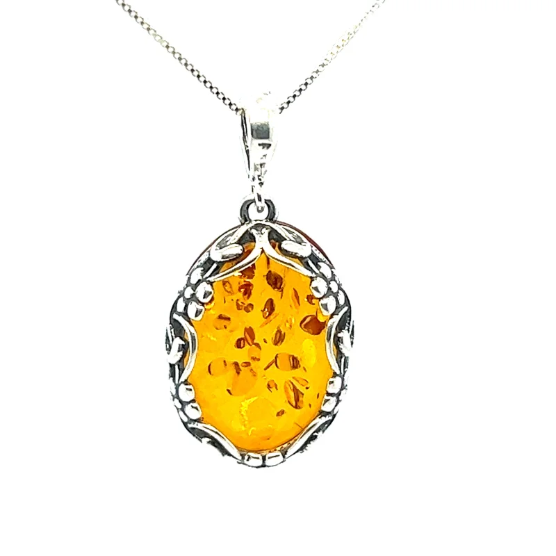 Cognac Amber Oval Pendant with Floral Border