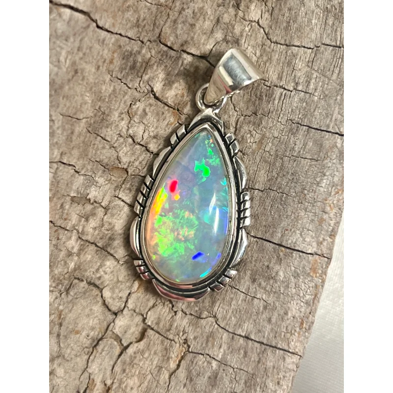 Ethiopian Opal Teardrop Shaped Pendant with Detailed Setting